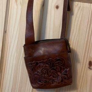 Dark brown medium crossbody bag. Never been used . New
